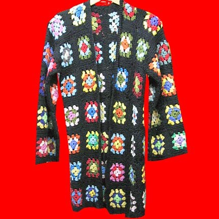 Crochet blocks in multi colors on Black background with bursting centers button front long sleeve jacket sweater