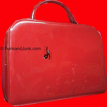 Shiny bright Reddish Orange Tolin mfg. rectangular purse with large wrapped handles and zipper side mod bag