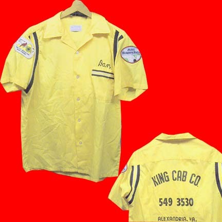 Hilton Yellow with Black Yellow and White elastic underarm bands and front pocket trim bowling shirt