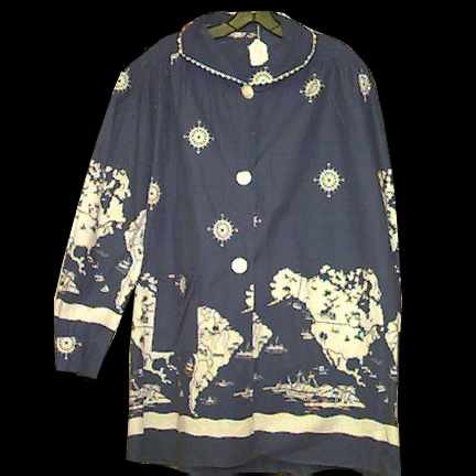 Blue Beach Cover Up with White Countries with Animals People Etc on Them and Ships at Sea and Compasses with White Disc Buttons