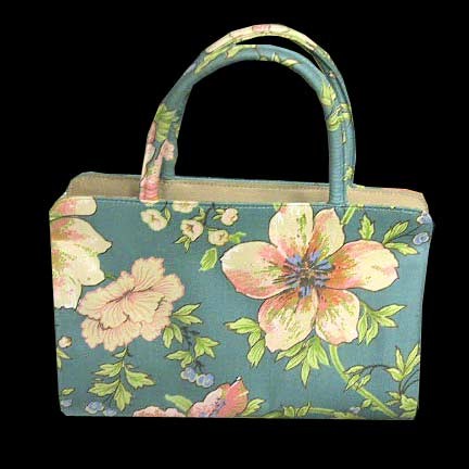 Margaret Smith Green with large Pink with Blue Centers Flowers on Stems Purse