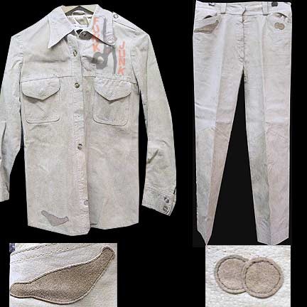 Tan Suede Womans Bell Bottom Leather Suit with small Darker Brown Bird Shaped Patch Accent on Hem of Jacket