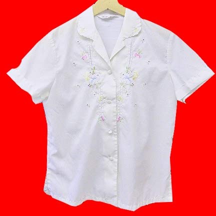 Daffodil White with embroidered flowers and leaves in Pink Blue Yellow with occasional open stitched panels short sleeve blouse