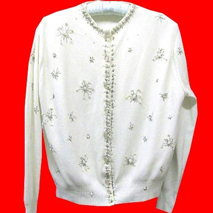 White with beaded starbursts with " pearl " spoke ends and other matching trim beading beaded sweater